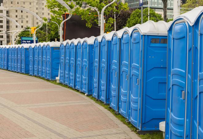 a row of portable restrooms set up for a special event, providing guests with a comfortable and sanitary option in Catonsville